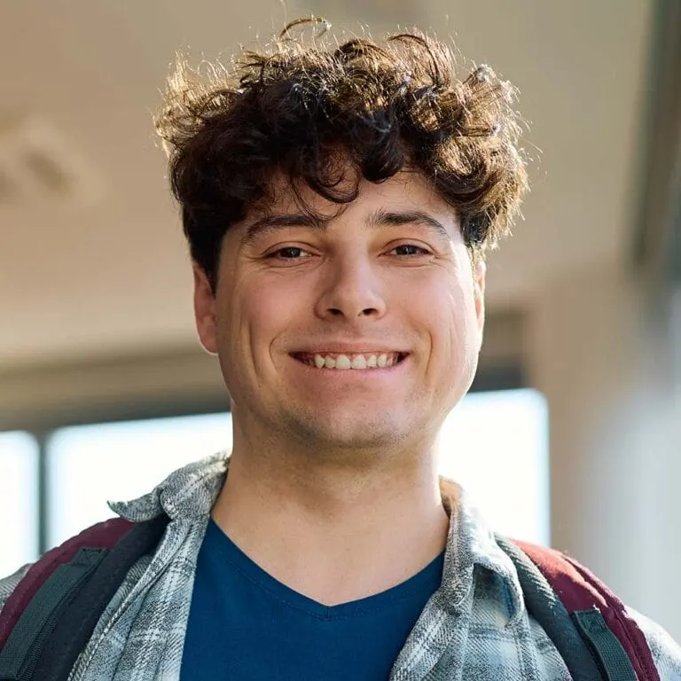 Happy Melbourne Tech Institute student studying in a classroom