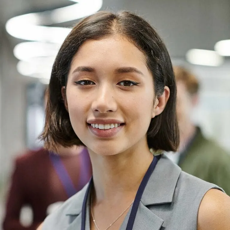 Professional Melbourne Tech Institute graduate smiling in the workplace